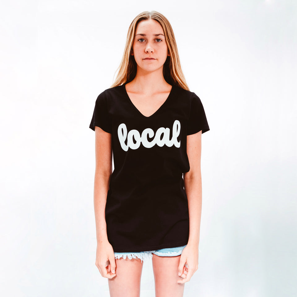 Model Shot wearing Womens Black 100% cotton T-shirt with Local logo in White